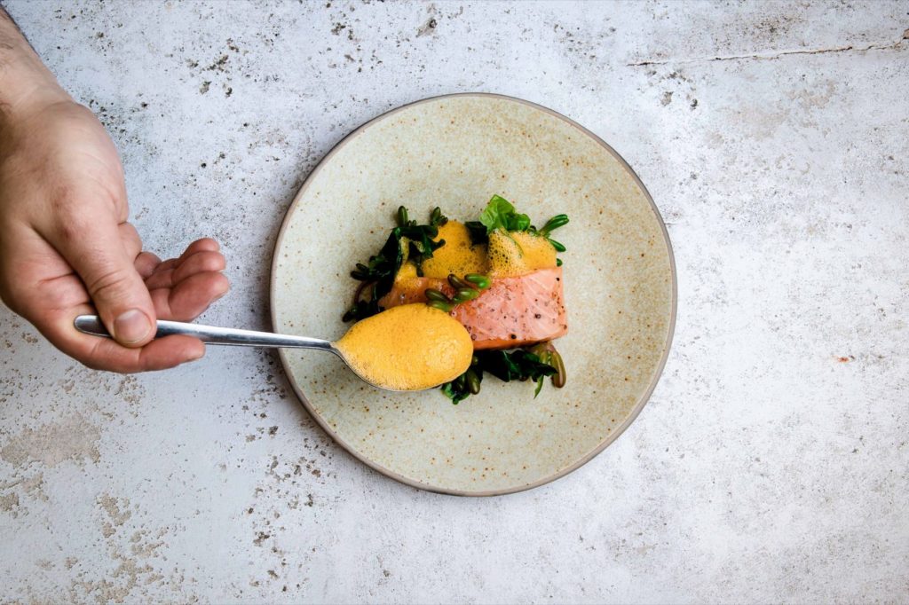 The finishing touches to a plate of food.