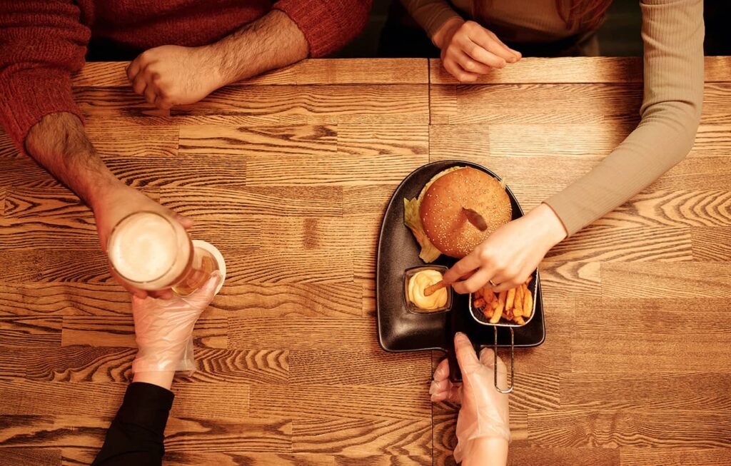 Customers enjoying their food at a restaurant that has a great website.