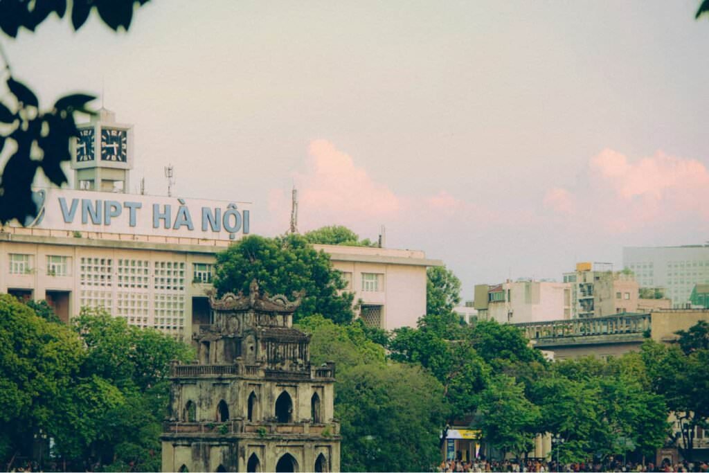 a city scene in hanoi by the lake in the morning